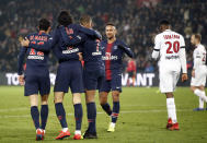 PSG's Kylian Mbappe, 3rd left, celebrates after scoring his side's third goal during the League One soccer match between Paris Saint Germain and Guingamp at the Parc des Princes stadium in Paris, Saturday, Jan. 19, 2019. (AP Photo/Michel Euler)