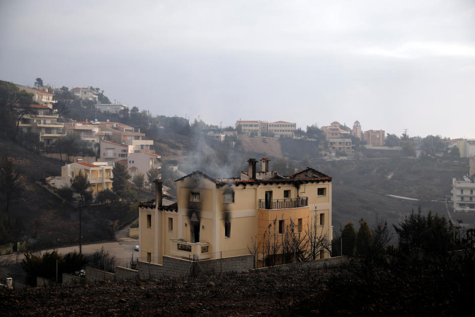 <p>A house burns following a wildfire at Neos Voutzas, near Athens, Greece, July 24, 2018. (Photo: Alkis Konstantinidis/Reuters) </p>