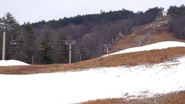 A ski resort with little snow in the winter.