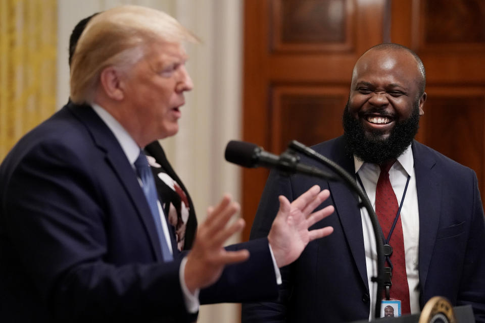 WASHINGTON, DC - OCTOBER 04: U.S. President Donald Trump introduces White House Deputy Director of the Office of American Innovation Ja’Ron Smith during an event for the Young Black Leadership Summit in the East Room of the White House October 04, 2019 in Washington, DC. Organized by the conservative nonprofit political group Turning Points USA, the summit bills itself as a professional development, leadership training and networking opportunity. (Photo by Chip Somodevilla/Getty Images)