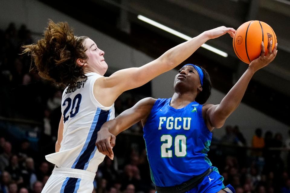 Villanova's Maddy Siegrist (20) blocks a shot by Florida Gulf Coast's Sha Carter during the first half of a second-round college basketball game in the NCAA Tournament, Monday, March 20, 2023, in Villanova, Pa. (AP Photo/Matt Rourke)