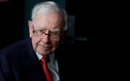 FILE PHOTO: Warren Buffett, CEO of Berkshire Hathaway Inc, pauses while playing bridge as part of the company annual meeting weekend in Omaha, Nebraska U.S. May 6, 2018. REUTERS/Rick Wilking