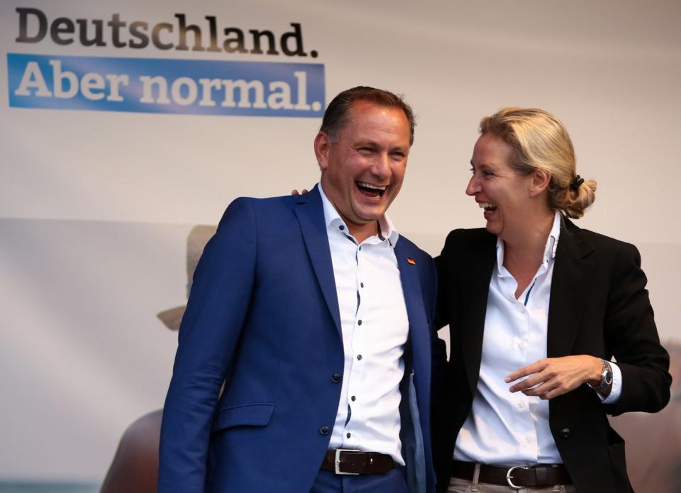 Tino Chrupalla (L) and Alice Weidel, co-lead candidates for the Alternative for Germany (AfD) party, meet supporters at an AfD campaign rally on Aug. 10, 2021 in Schwerin, Germany. (Adam Berry/Getty Images)