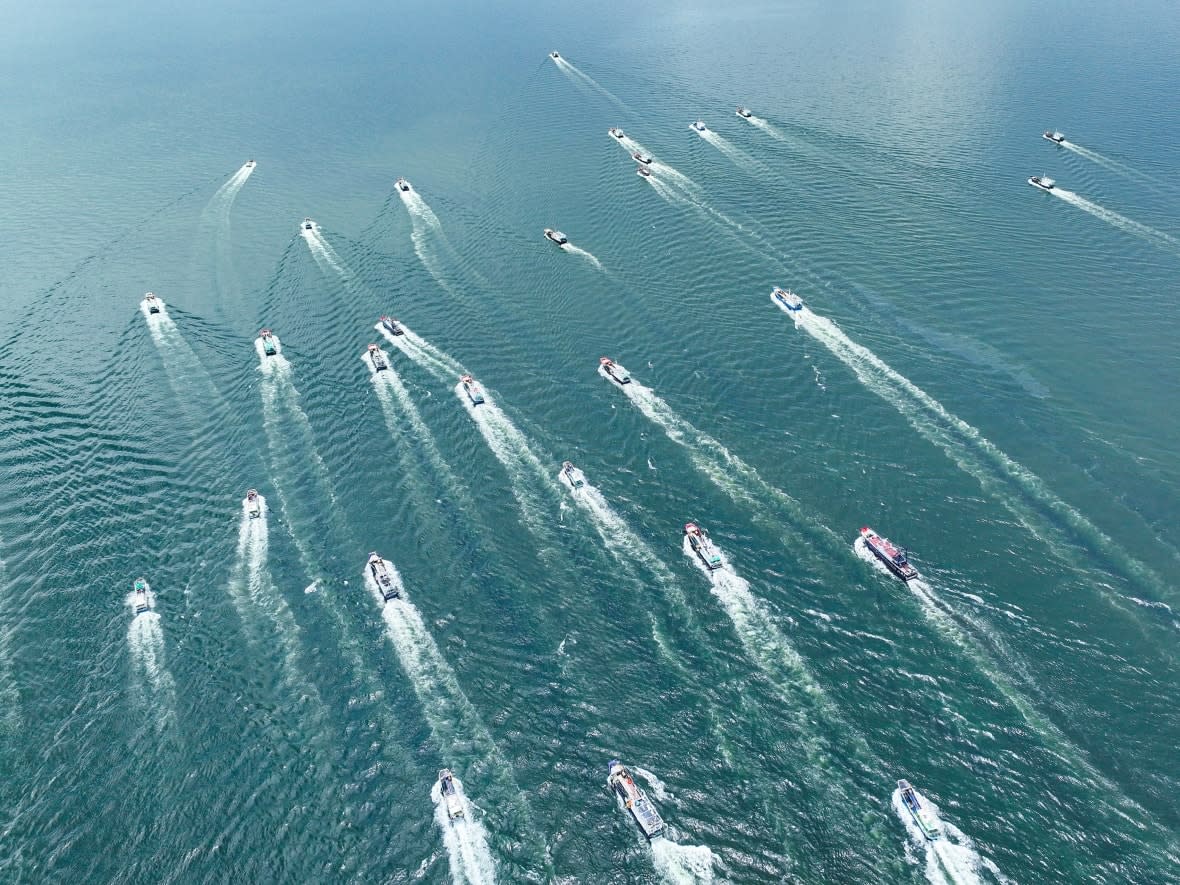 Fishing boats head out to sea on the first day of the fishing season in Yangjiang, China, on Aug. 16, 2022. (AFP via Getty Images - image credit)