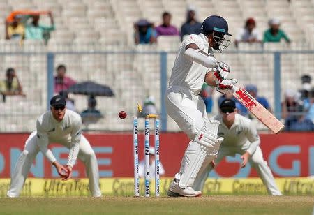 Cricket - India v New Zealand - Second Test cricket match - Eden Gardens, Kolkata - 30/09/2016. India's Shikhar Dhawan is bowled by New Zealand's Matt Henry. REUTERS/Rupak De Chowdhuri