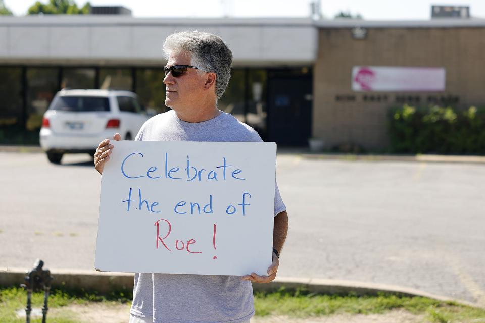 Anti-abortion activists celebrated Friday’s decision outside the Tulsa Women’s Clinic in Tulsa, Oklahoma Friday. - Credit: Mike Simons/Tulsa World via AP