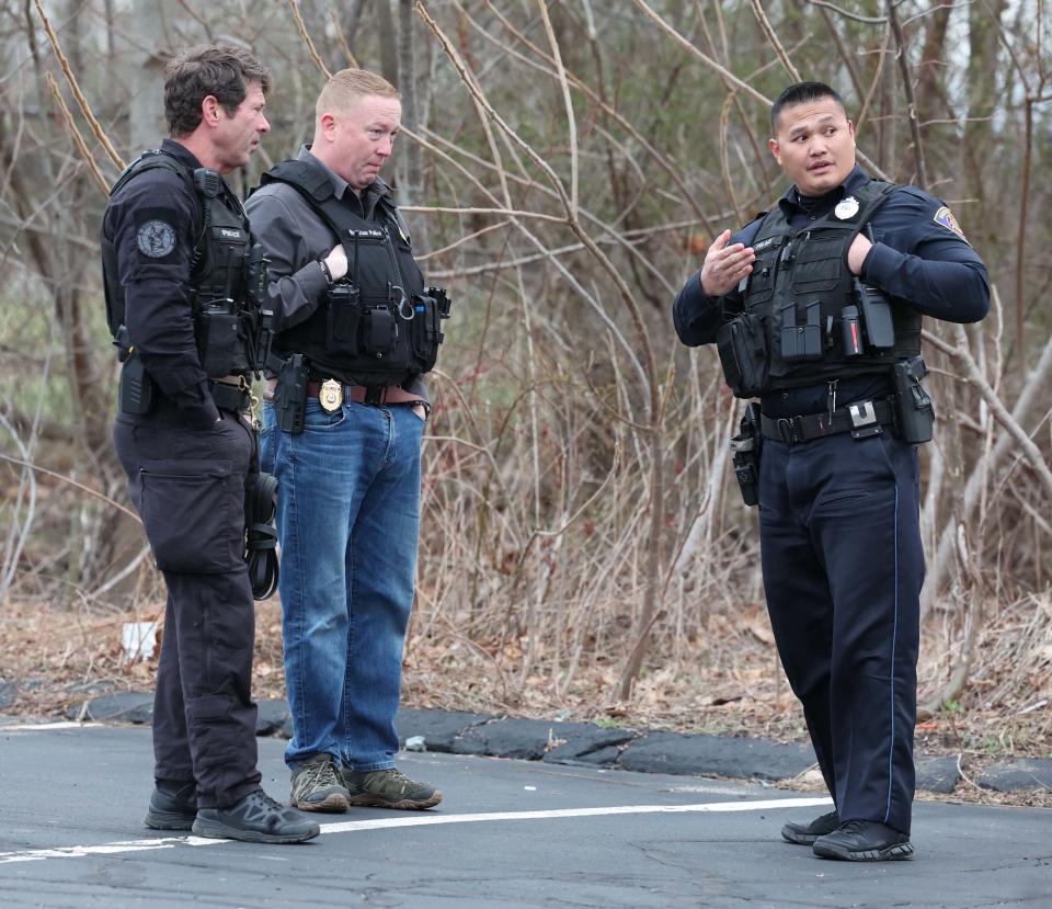 Brockton police investigate a stabbing of a 14-year-old boy behind Cardinal Spellman High School on Court Street on Friday, April 5, 2024. Police said the stabbing had nothing to do with the high school.