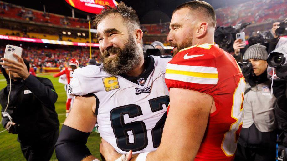 Jason Kelce and Travis Kelce embrace on the field