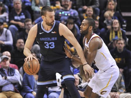 Dec 26, 2018; Memphis, TN, USA; Memphis Grizzlies center Marc Gasol (33) handles the ball against Cleveland Cavaliers guard Alec Burks (10) during the second half at FedExForum. Memphis Grizzlies defeated the Cleveland Cavaliers 95-87. Mandatory Credit: Justin Ford-USA TODAY Sports