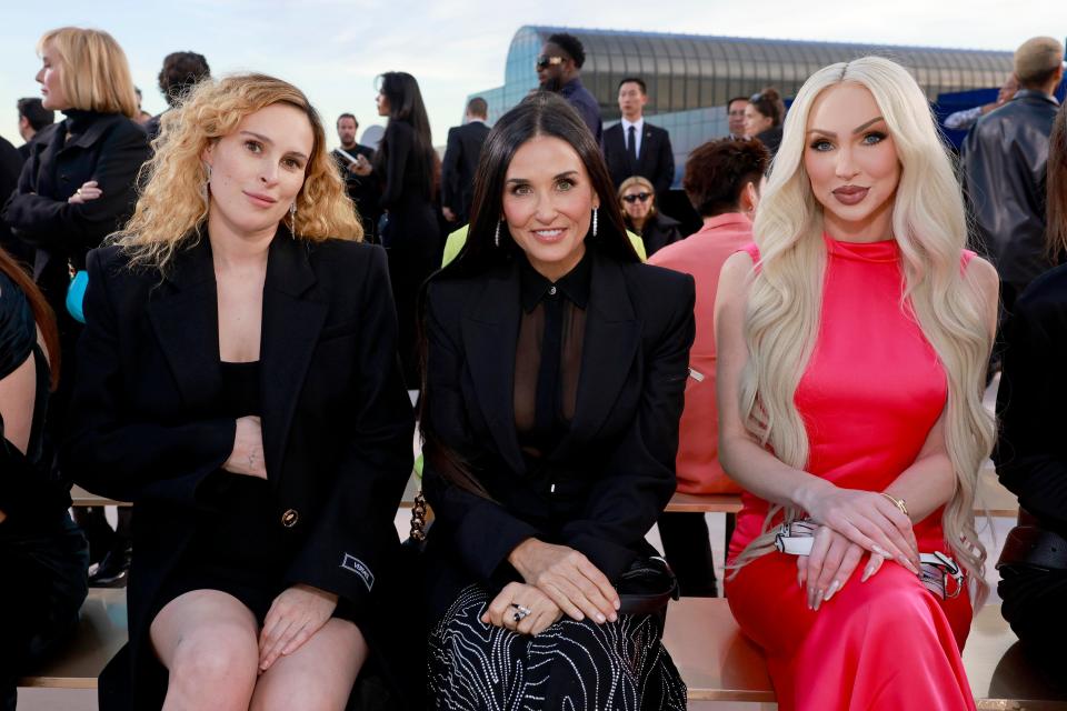 From left to right, Rumer Willis, Demi Moore and Christine Quinn sat side-by-side at the Versace show.