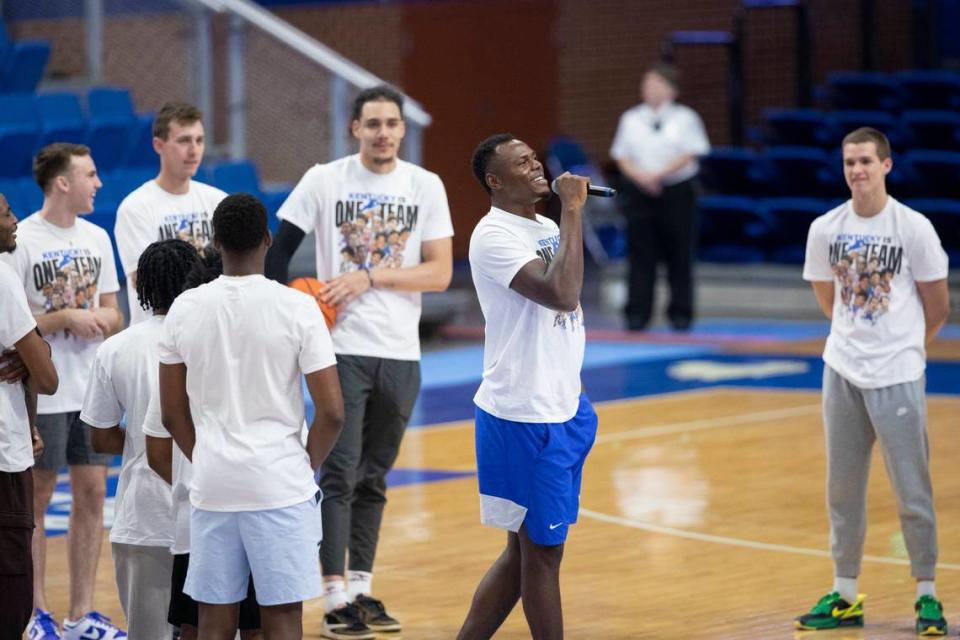 Kentucky star Oscar Tshiebwe speaks to fans gathered during an open practice and telethon to raise money for flood relief at Rupp Arena on Aug. 2, 2022.