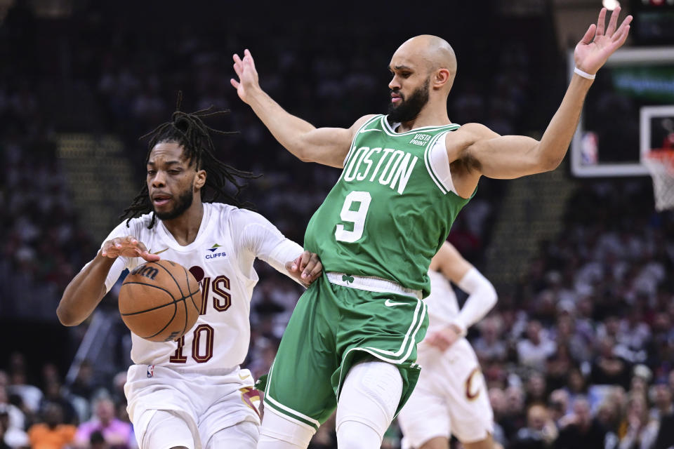 Cleveland Cavaliers guard Darius Garland (10) drives against Boston Celtics guard Derrick White (9) during the first half of Game 4 of an NBA basketball second-round playoff series, Monday, May 13, 2024, in Cleveland. (AP Photo/David Dermer)