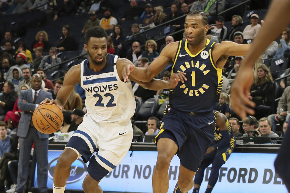 Minnesota Timberwolves' Andrew Wiggins, left, drives against Indiana Pacers' T.J. Warren in the first half of an NBA basketball game Wednesday, Jan. 15, 2020, in Minneapolis. (AP Photo/Jim Mone)