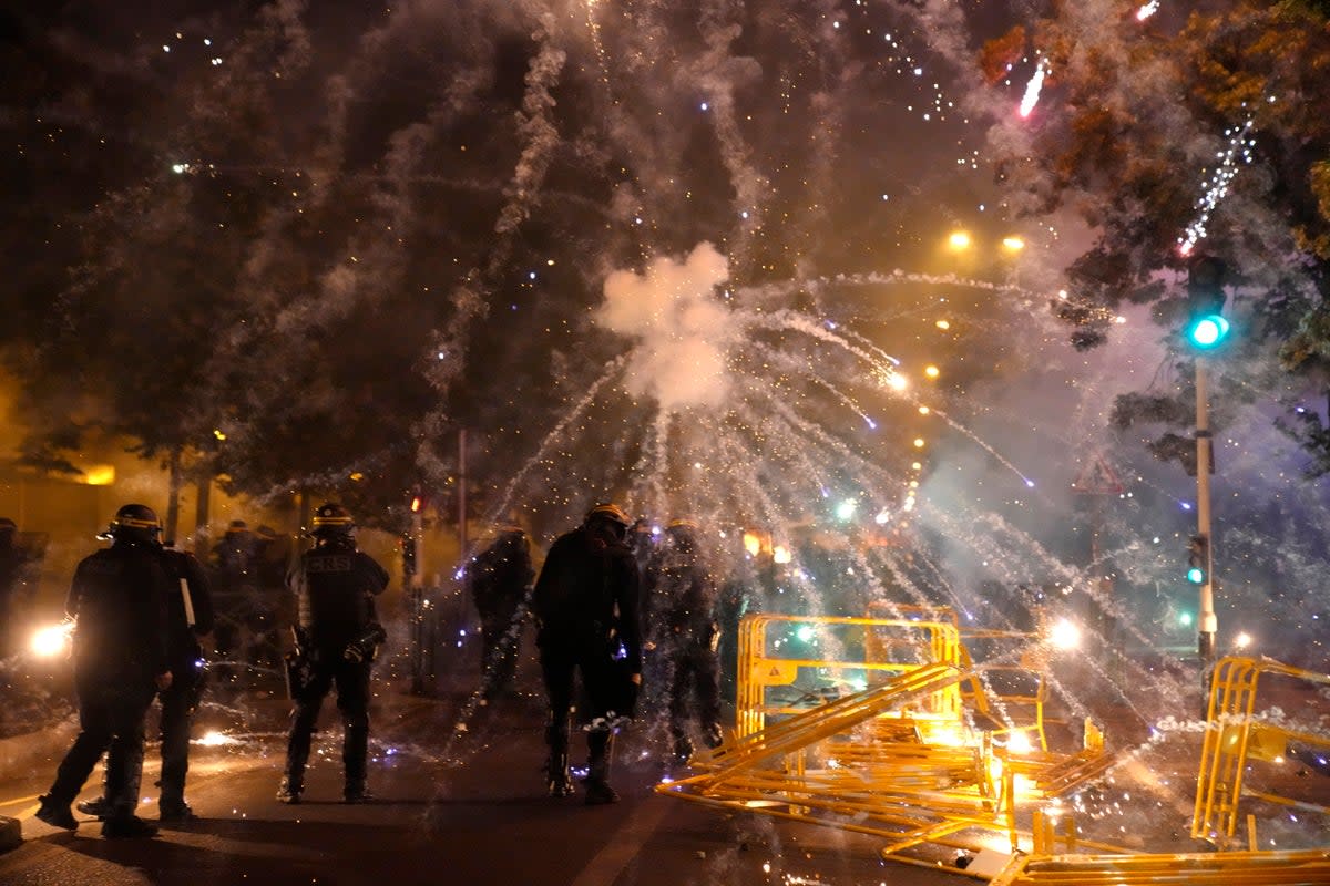 Police forces clash with protesters in Nanterre (AP Photo/Christophe Ena)