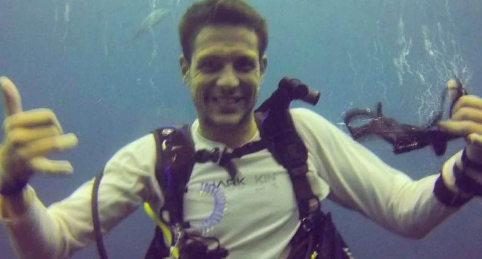 Simon Nellist can be seen underwater smiling and gesturing the shaka sign with both hands before the fatal shark attack.