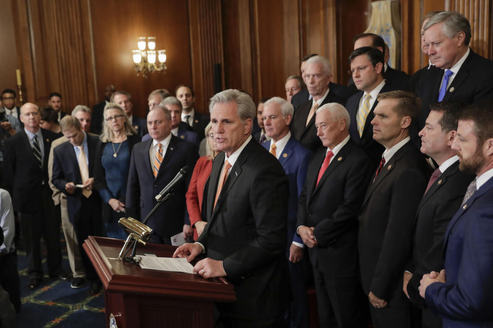 House Minority Leader Kevin McCarthy of Calif., center, join by fellow Republican lawmakers speaks during a news conference on Capitol Hill in Washington, Thursday, Oct. 31, 2019. Democrats rammed a package of ground rules for their impeachment inquiry of President Donald Trump through a sharply divided House. (AP Photo/Pablo Martinez Monsivais)