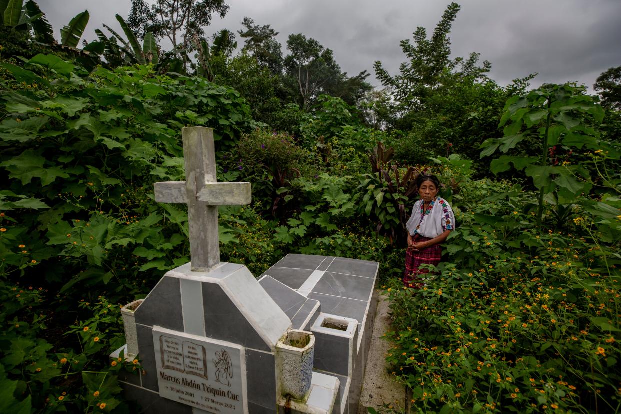 Juana Cuc visits the grave of her son, Marcos Abdon Tziquin Cuc, who left his Mayan village in Guatemala in hopes of working in the U.S. He was detained by Mexican authorities on the outskirts of Juárez and transferred to a migrant detention center where he died in a March 27, 2023, fire. Forty migrants lost their lives.