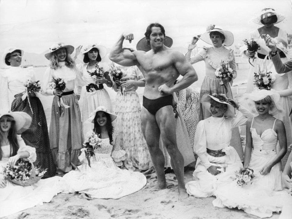 Arnold Schwarzenegger poses on Cannes beach during the film festival.