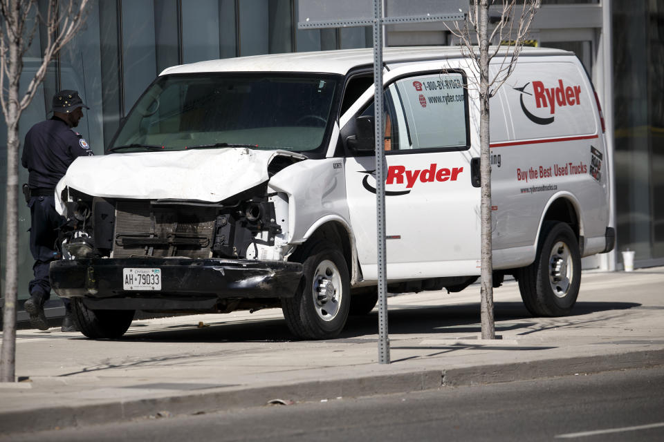 Police inspect a van suspected of being involved in a collision injuring at least eight people at Yonge St. and Finch Ave. on April 23, 2018 in Toronto, Canada. A suspect is in custody after a white van collided with multiple pedestrians. (Photo by Cole Burston/Getty Images)