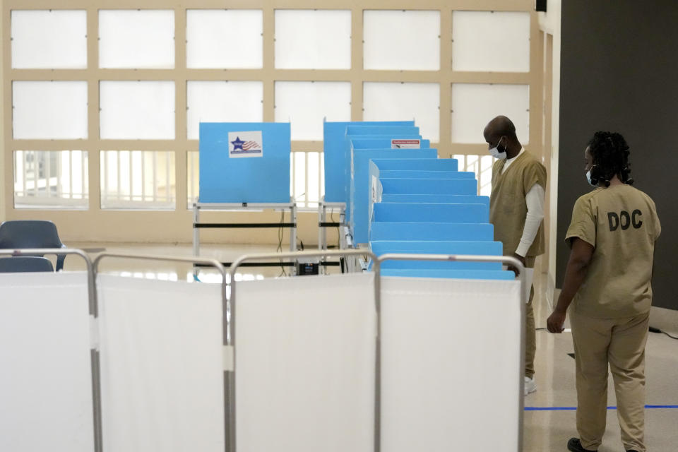 Inmates at the Cook County, Ill., jail vote in a local election at the jail's Division 11 Chapel on Saturday, Feb. 18, 2023, in Chicago. (AP Photo/Charles Rex Arbogast)