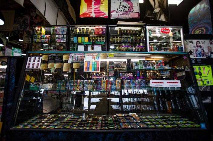 A display case at Electric Ladyland in Louisville, Kentucky, shows off various delta-8 products that can be eaten or vaped. Jan. 19, 2023