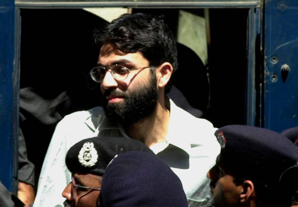 In this March 29, 2002 file photo, Ahmed Omar Saeed Sheikh, the alleged mastermind behind Wall Street Journal reporter Daniel Pearl's kidnap-slaying, appears at the court in Karachi, Pakistan. On Thursday, Dec. 24, 2020, a provincial court in Pakistan overturned a Supreme Court Decision that Sheikh should remain in custody during an appeal of his acquittal on charges he murdered Pearl.