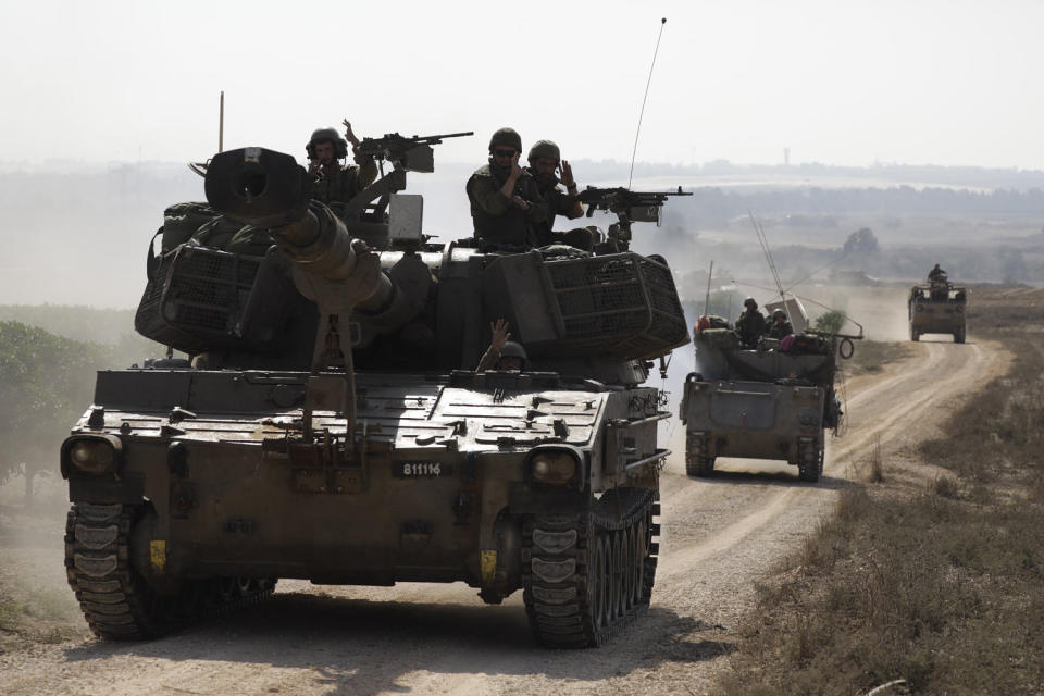 Israeli military vehicles travel near the border with the Gaza Strip in Sderot, Israel (Amir Levy / Getty Images)