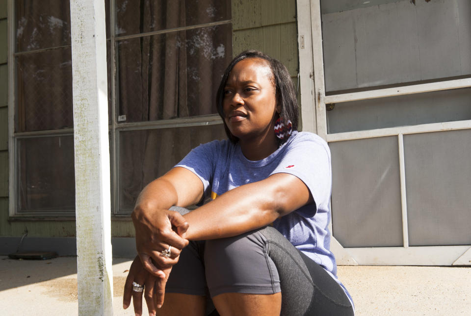 Sheena Godbolt, 33, sits on her sister's porch in Bogue Chitto. (Photo: Melissa Jeltsen/HuffPost)