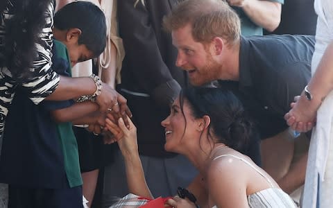 The Duke and Duchess of Sussex meet wellwishers along a Kingfisher Bay walkabout  - Credit: Chris Hyde /Getty