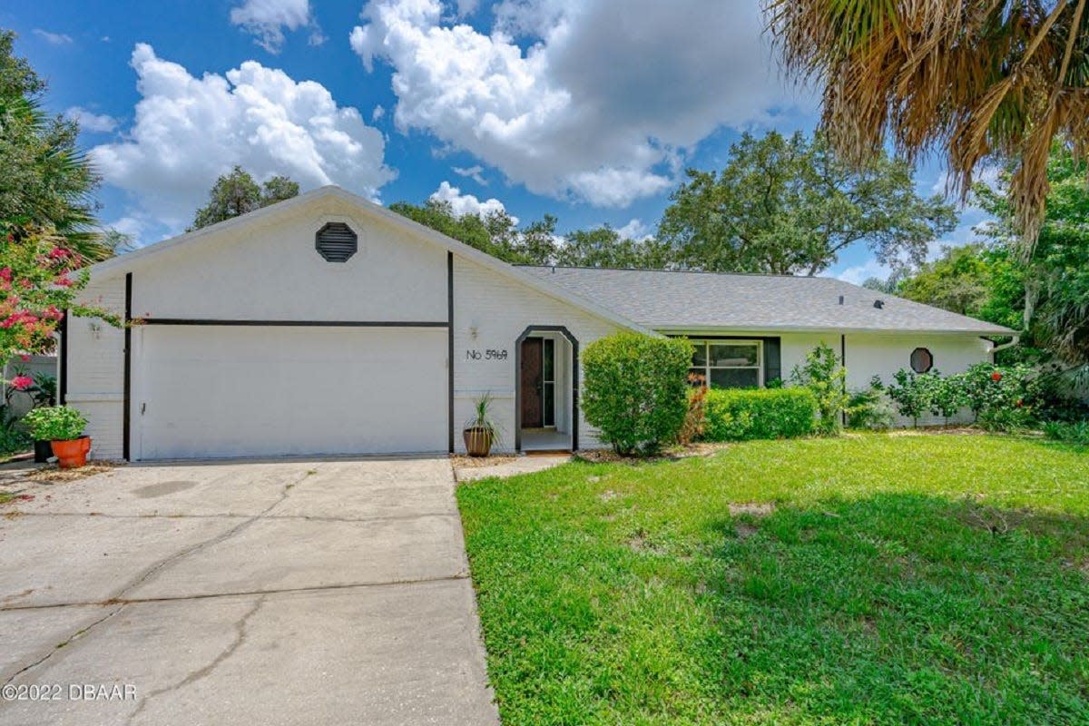 This lovingly updated three-bedroom, two-bath home in the heart of Port Orange is zoned for Spruce Creek High School and is within walking distance to an ice-cream store and parks for children, adults and dogs.