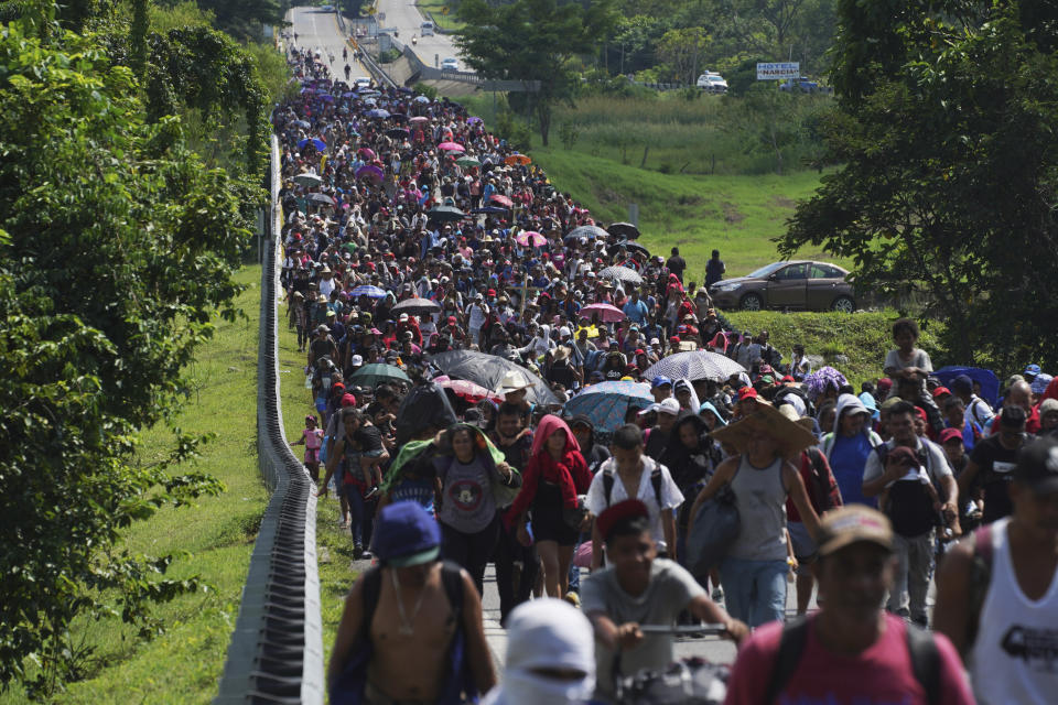 Migrants arrive in Villa Comaltitlan, Chiapas state, Mexico, Wednesday, Oct. 27, 2021, as they continue their journey through Mexico to the U.S. border. (AP Photo/Marco Ugarte)