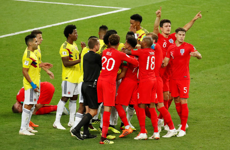<p>From the resulting free kick Colombia Wilmar Barrios is yellow carded for headbutting Jordan Henderson while Harry Maguire gestures for VAR </p>