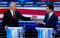 Former Vice President Biden and former South Bend Mayor Buttigieg discuss an issue at the ninth Democratic 2020 U.S. Presidential candidates debate in Las Vegas Nevada, U.S.
