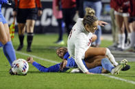 Alabama's Ashlynn Serepca, top, is taken down by UCLA's Sunshine Fontes during the first half of an NCAA women's soccer tournament semifinal in Cary, N.C., Friday, Dec. 2, 2022. (AP Photo/Karl B DeBlaker)