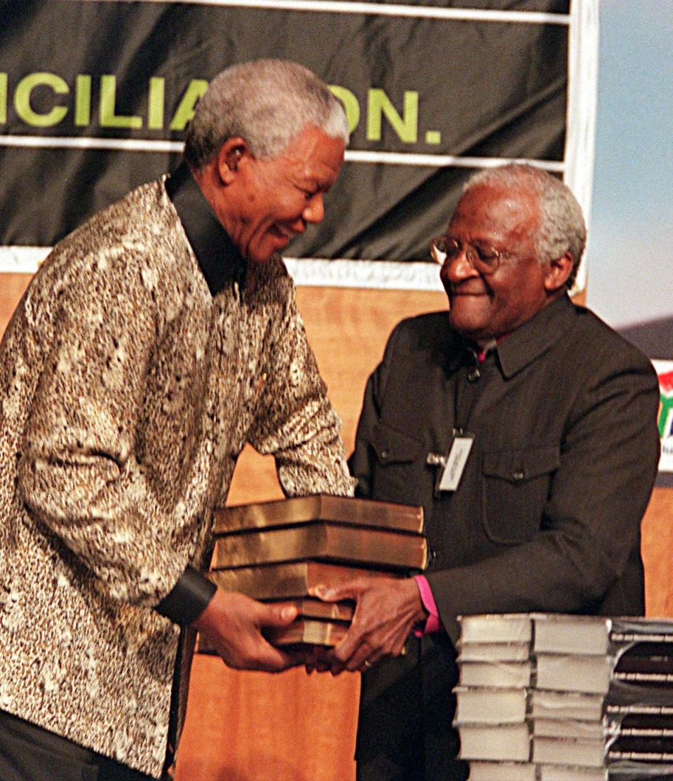 Nelson Mandela with Desmond TuTu (Adil Bradlow / AP)