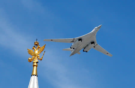 FILE PHOTO: A Tu-160 heavy strategic bomber flies during the Victory Day parade above Red Square in Moscow, Russia, May 9, 2015. REUTERS/Grigory Dukor/File Photo