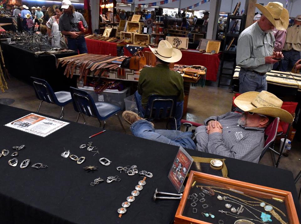 Cowboys shop, sell and snooze in the Round Building Saturday.