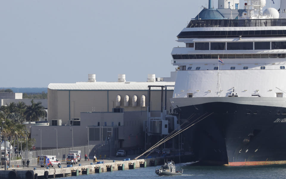 Ambulances, at left, arrive after the cruise ship Zaandam docked at Port Everglades, Thursday, April 2, 2020, in Fort Lauderdale, Fla. (AP Photo/Wilfredo Lee)