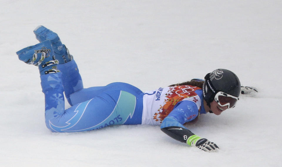 Slovenia's Tina Maze celebrates taking the lead in the second run of the women's giant slalom at the Sochi 2014 Winter Olympics, Tuesday, Feb. 18, 2014, in Krasnaya Polyana, Russia. (AP Photo/Charlie Riedel)