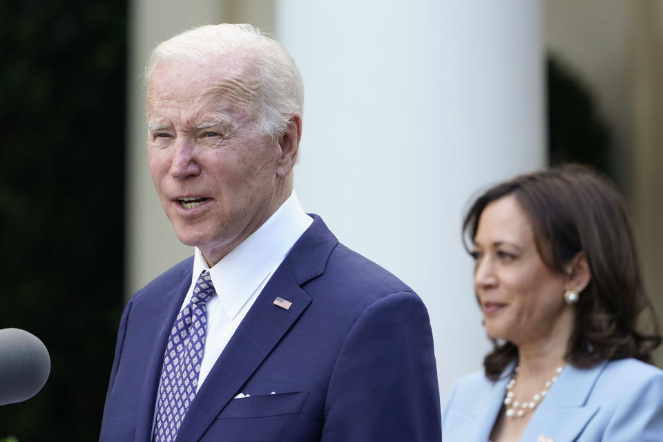 President Joe Biden speaks as Vice President Kamala Harris listens in the Rose Garden of the White House in Washington, Tuesday, May 17, 2022, during a reception to celebrate Asian American, Native Hawaiian, and Pacific Islander Heritage Month. (AP Photo/Susan Walsh)