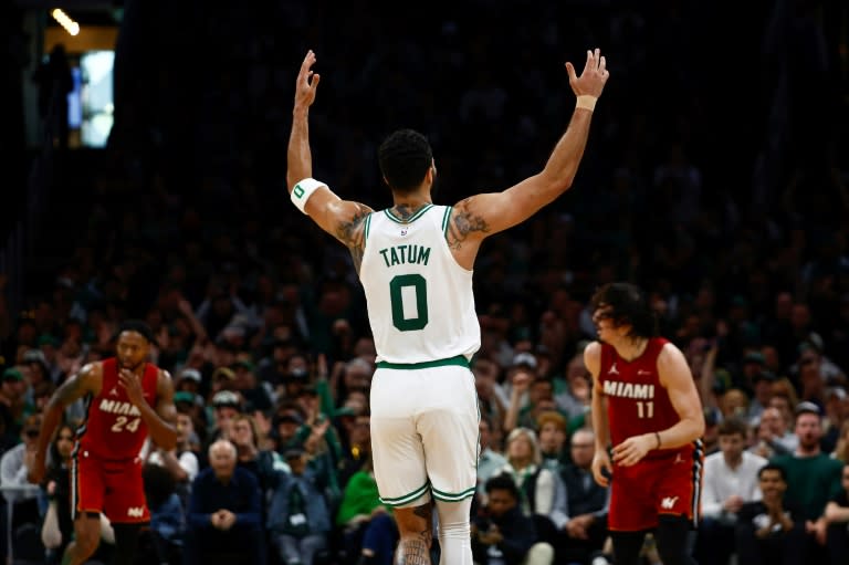 <a class="link " href="https://sports.yahoo.com/nba/players/5765/" data-i13n="sec:content-canvas;subsec:anchor_text;elm:context_link" data-ylk="slk:Jayson Tatum;sec:content-canvas;subsec:anchor_text;elm:context_link;itc:0">Jayson Tatum</a> of the <a class="link " href="https://sports.yahoo.com/nba/teams/boston/" data-i13n="sec:content-canvas;subsec:anchor_text;elm:context_link" data-ylk="slk:Boston Celtics;sec:content-canvas;subsec:anchor_text;elm:context_link;itc:0">Boston Celtics</a> raises his hands after making a three point basket against the <a class="link " href="https://sports.yahoo.com/nba/teams/miami/" data-i13n="sec:content-canvas;subsec:anchor_text;elm:context_link" data-ylk="slk:Miami Heat;sec:content-canvas;subsec:anchor_text;elm:context_link;itc:0">Miami Heat</a> during the first quarter of game one of the Eastern Conference First Round Playoffs on Sunday. (Winslow Townson)