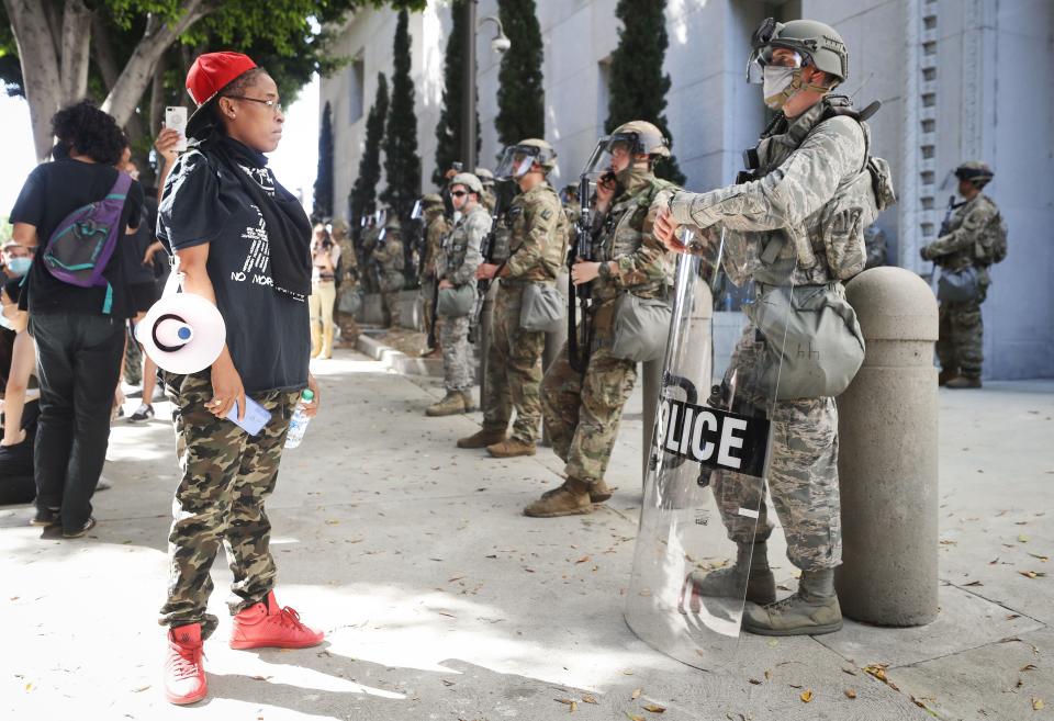 A protester looks at National Guard troops posted in Los Angeles on June 3. Jackson was among their ranks. (Photo: Mario Tama via Getty Images)