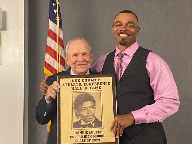 Former Estero High football, basketball and track and field star Frankie Luster was among eight members of the Lee County Athletic Conference Hall of Fame's Class of 2024. With him is former Estero head football coach Joe Hampton.