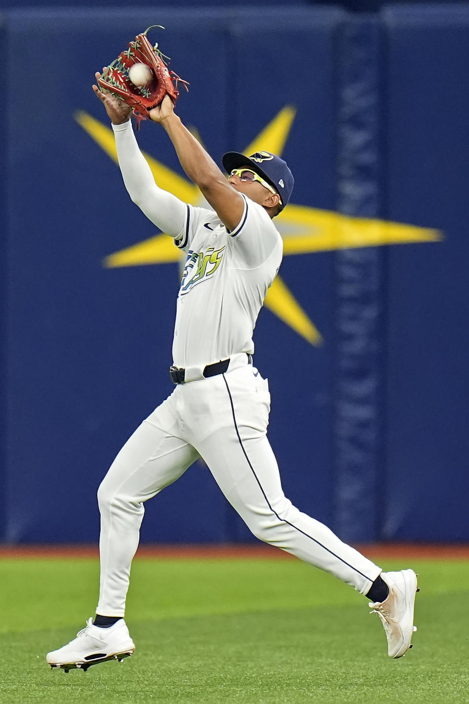Tampa Bay Rays right fielder Richie Palacios makes a running catch on a fly out by San Francisco Giants' Patrick Bailey during the fourth inning of a baseball game Friday, April 12, 2024, in St. Petersburg, Fla. (AP Photo/Chris O'Meara)