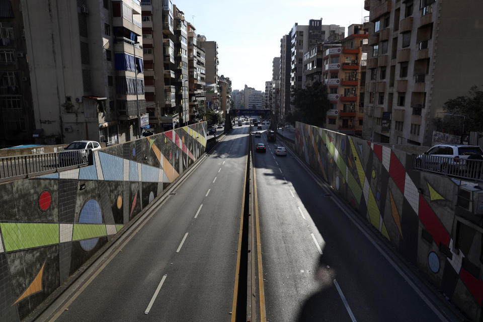 A highway is almost empty of cars during a lockdown aimed at curbing the spread of the coronavirus, in Beirut Lebanon, Thursday, Jan. 21, 2021. Authorities on Thursday extended a nationwide lockdown by a week to Feb. 8 amid a steep rise in coronavirus deaths and infections that has overwhelmed the health care system. (AP Photo/Bilal Hussein)