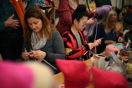 Knitters take part in the Pussyhat social media campaign to provide pink hats for protesters in the women's march in Washington, D.C., the day after the presidential inauguration, in Los Angeles, California, U.S., January 13, 2017. REUTERS/Lucy Nicholson