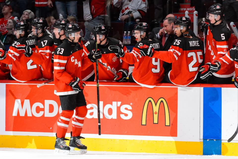 MONTREAL, QC - DECEMBER 29: Sam Reinhart #23 of Team Canada celebrates his goal with teammates on the bench during the 2015 IIHF World Junior Hockey Championship game against Team Finland at the Bell Centre on December 29, 2014 in Montreal, Quebec, Canada. (Photo by Minas Panagiotakis/Getty Images)