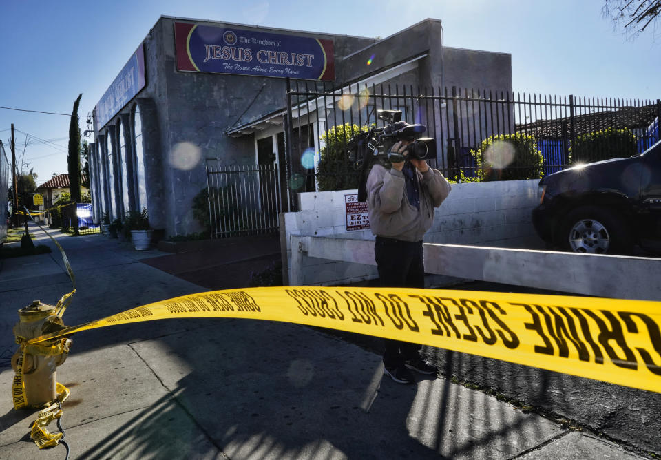 Crime scene tape is seen closing off an area around the grounds of the Kingdom of Jesus Christ Church in the Van Nuys section of Los Angeles on Wednesday, Jan. 29, 2020. The FBI raided a Philippines-based church in Los Angeles to arrest leaders of an alleged immigration fraud scheme that resulted in sham marriages. Federal prosecutors said Wednesday that three leaders of the local branch of the Kingdom of Jesus Christ were arrested in morning raids. (AP Photo/Richard Vogel)