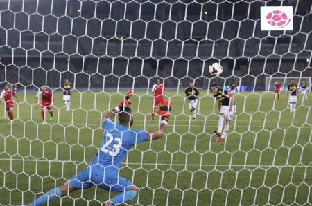 Radamel Falco of Colombia shoots to score a penalty against Kuwait during their international friendly soccer match in Abu Dhabi March 30, 2015. REUTERS/Stringer