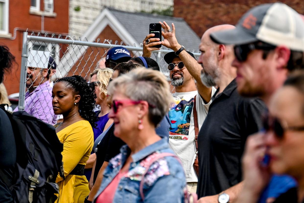 Musician and All of the Above Hip Hop Academy and Creative founder Ozay Moore records on his phone during a ground breaking ceremony for The Ovation music and arts venue on Wednesday, June 28, 2023, in downtown Lansing.